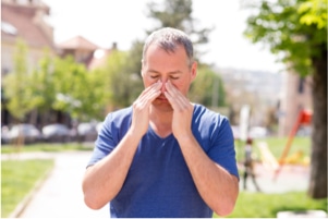 Man holding his nose