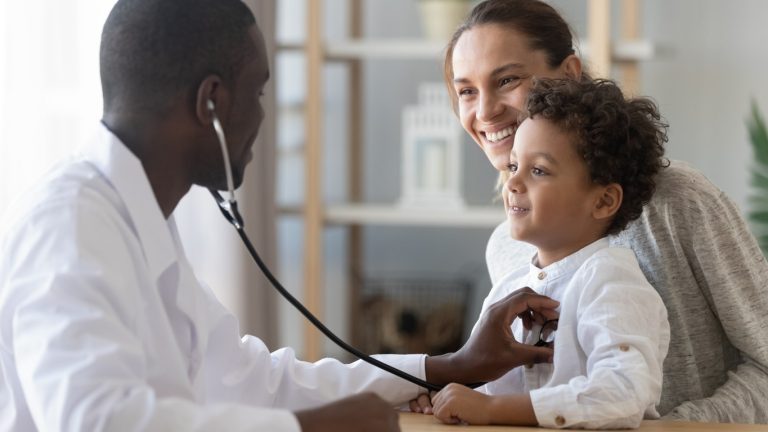 Doctor listening to a child's lungs