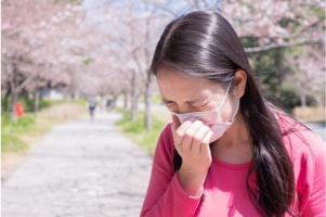 Woman sneezing