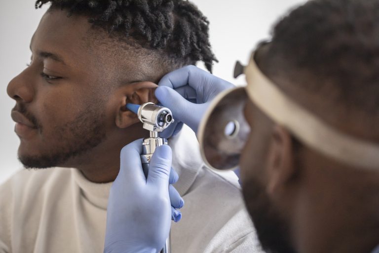 doctor looking at patient ear