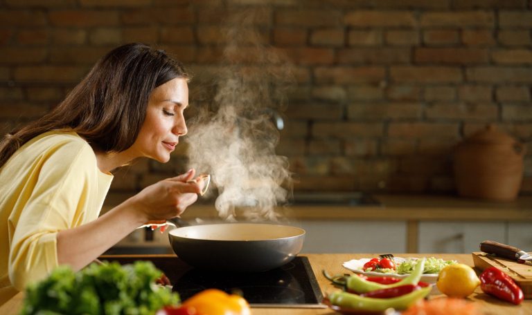 woman eating soup