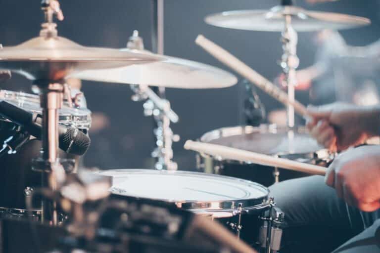 Close up of drummer playing during a show.