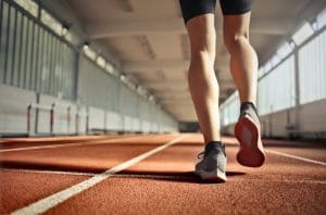 Person walking on an indoor track