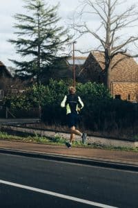 A jogger running outside.